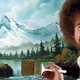 Bob Ross smiling in front of a landscape painting